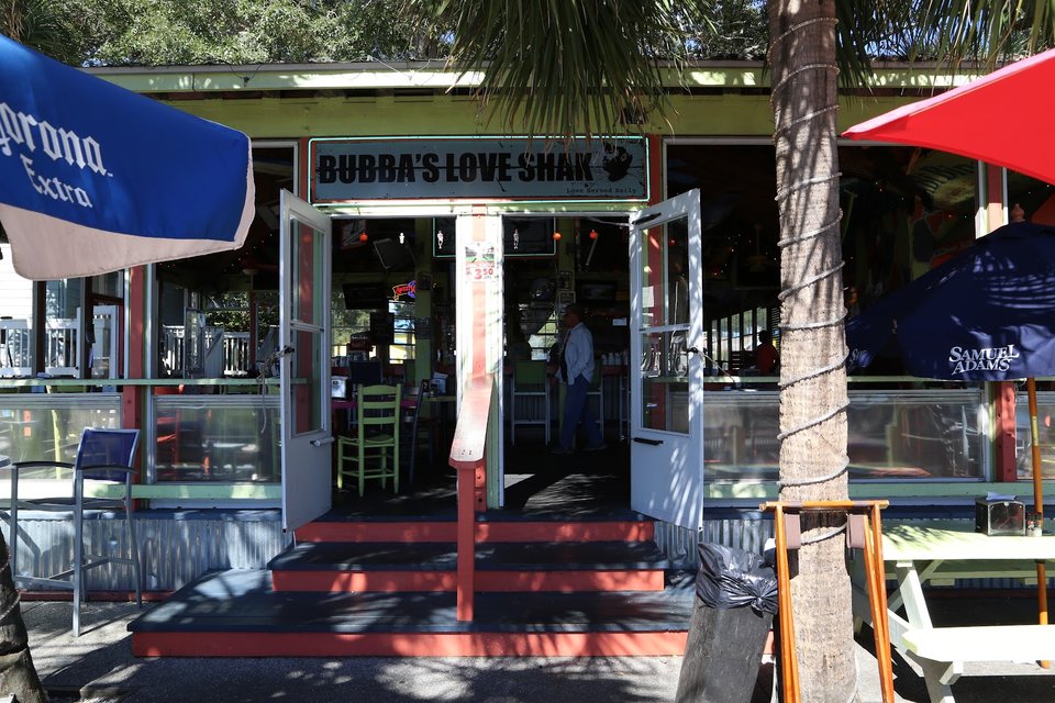Colorful restaurant exterior with patio seating.